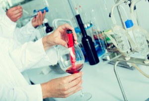 Wine being checked on component saturation in laboratory on winery factory